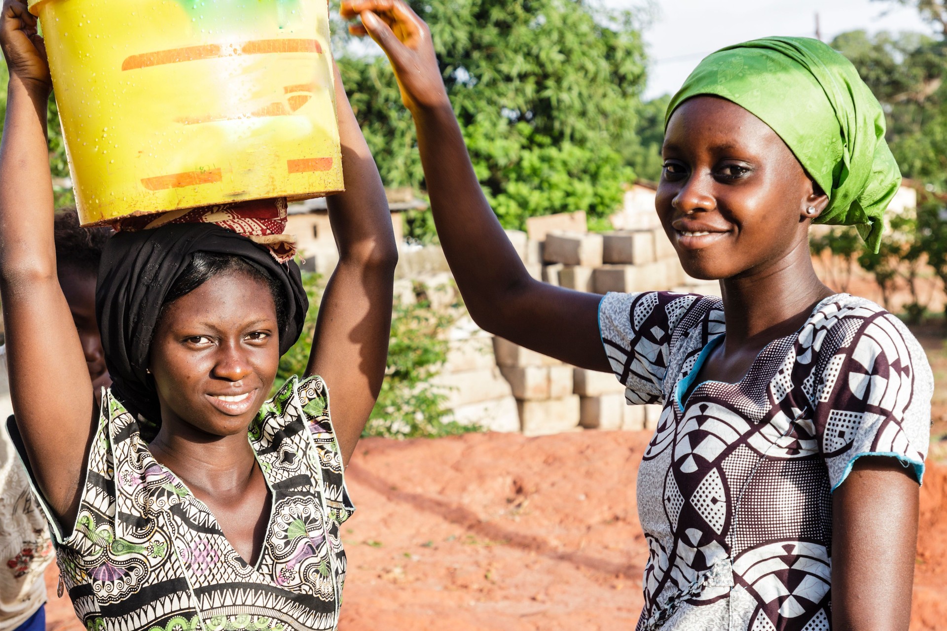 Two young women carrying water in Africa